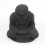 Buddha statuette in black stone, Zen Buddhist altar decoration.