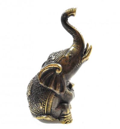 Statuette elephant sitting trunk in the air, lucky feng shui.