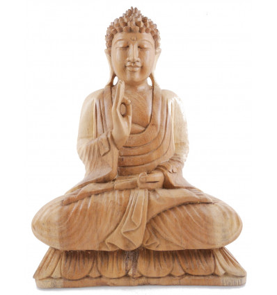 Buddha statue sitting on lotus. Mudra of argumentation.