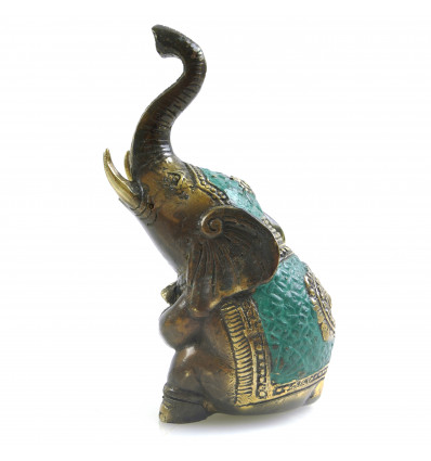 Statuette elephant sitting trunk up in the air in Bronze. Lucky Feng Shui.